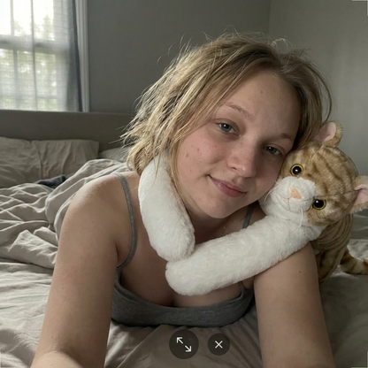 Cuddles the Weighted Cat™ — The weighted plushie whose arms actually hug you back